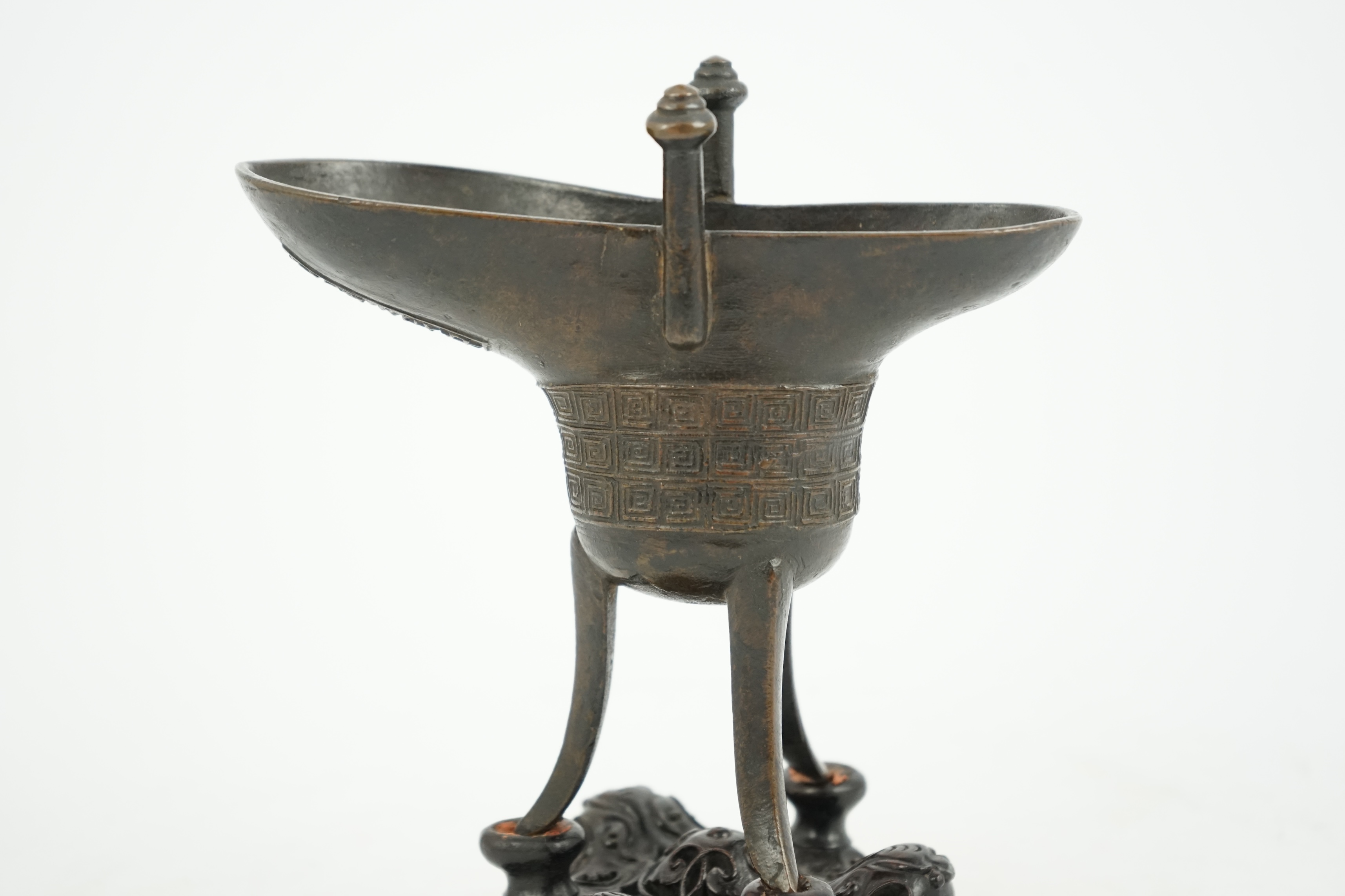 A good Chinese archaistic bronze tripod wine cup, jue, dated Qianlong 3rd year, corresponding to 1738